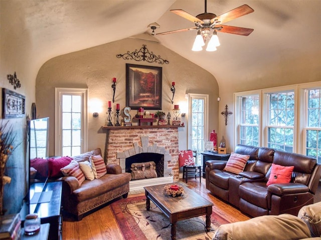 1818 N Union Ave, Shawnee, OK 74804 - living room featuring wood finished floors, a ceiling fan, lofted ceiling, and a fireplace