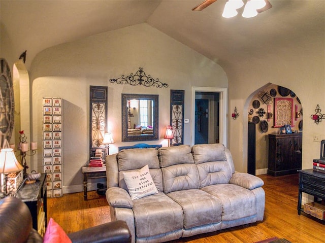1818 N Union Ave, Shawnee, OK 74804 - living room featuring arched walkways, a ceiling fan, lofted ceiling, and wood finished floors
