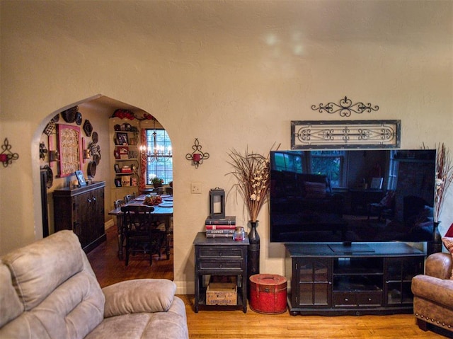 1818 N Union Ave, Shawnee, OK 74804 - living area featuring arched walkways and wood finished floors