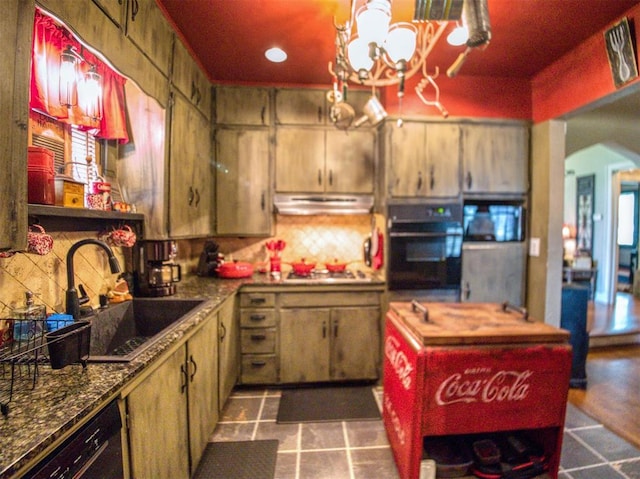 1818 N Union Ave, Shawnee, OK 74804 - kitchen with black appliances, a sink, a chandelier, arched walkways, and under cabinet range hood