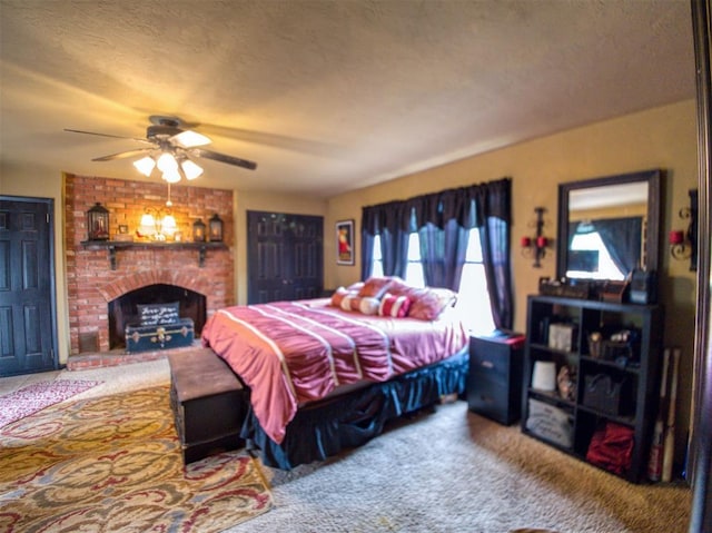 1818 N Union Ave, Shawnee, OK 74804 - bedroom with carpet floors, a brick fireplace, and a ceiling fan
