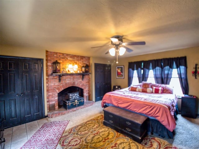1818 N Union Ave, Shawnee, OK 74804 - tiled bedroom featuring a fireplace and a ceiling fan
