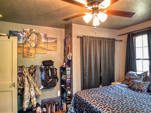 1818 N Union Ave, Shawnee, OK 74804 - bedroom featuring a textured ceiling and ceiling fan