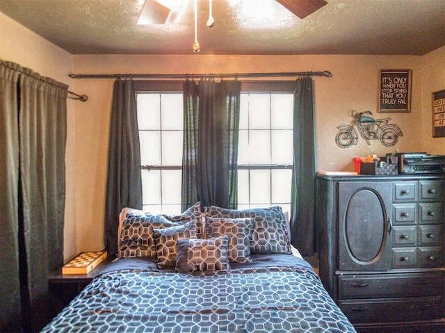 1818 N Union Ave, Shawnee, OK 74804 - bedroom featuring multiple windows and a ceiling fan