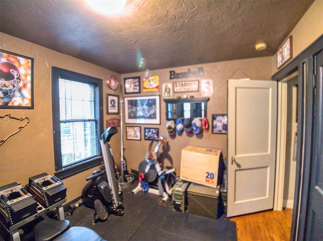 1818 N Union Ave, Shawnee, OK 74804 - exercise area featuring a textured ceiling and a textured wall