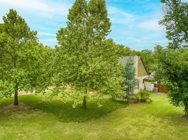 1818 N Union Ave, Shawnee, OK 74804 - view of green lawn featuring a garage