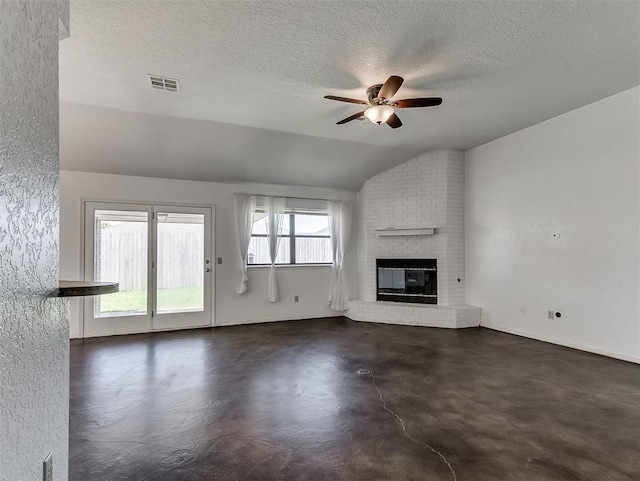 1621 Park View Pl, Edmond, OK 73003 - unfurnished living room featuring visible vents, a brick fireplace, a textured ceiling, a ceiling fan, and vaulted ceiling