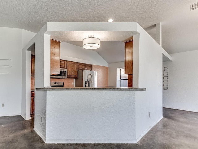 1621 Park View Pl, Edmond, OK 73003 - kitchen featuring brown cabinetry, finished concrete flooring, baseboards, and stainless steel appliances