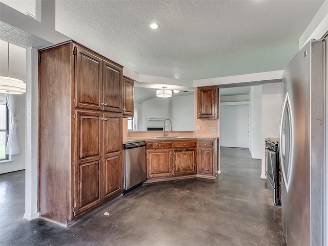 1621 Park View Pl, Edmond, OK 73003 - kitchen with a textured ceiling, concrete flooring, a sink, light countertops, and stainless steel appliances