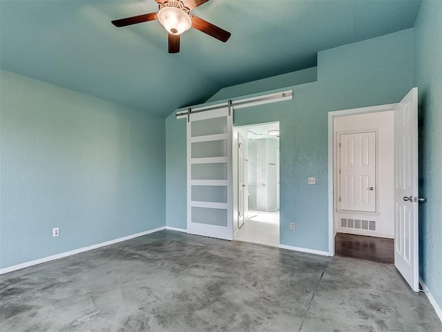 1621 Park View Pl, Edmond, OK 73003 - unfurnished bedroom featuring visible vents, lofted ceiling, baseboards, a barn door, and concrete floors