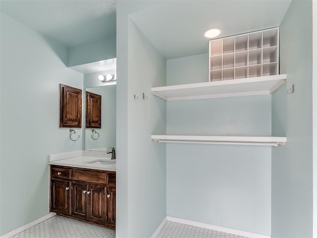 1621 Park View Pl, Edmond, OK 73003 - bathroom featuring baseboards, tile patterned floors, and vanity
