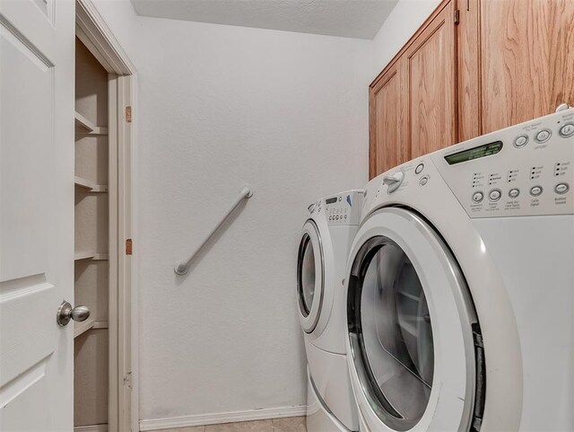 1621 Park View Pl, Edmond, OK 73003 - clothes washing area featuring cabinet space and washer and dryer