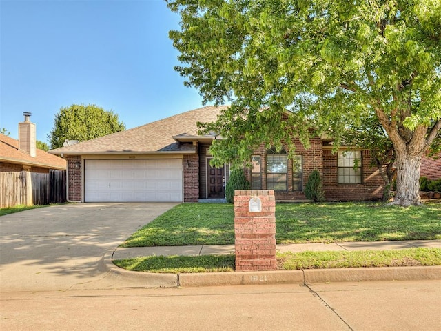 1621 Park View Pl, Edmond, OK 73003 - view of front facade with an attached garage, a front lawn, fence, and concrete driveway