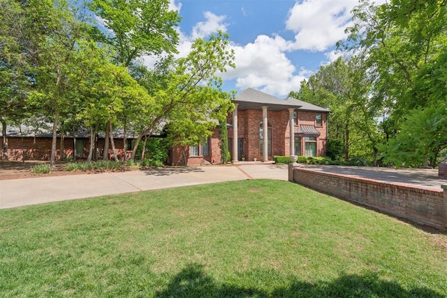 4200 Oakdale Farm Cir, Edmond, OK 73013 - exterior space with brick siding and a lawn