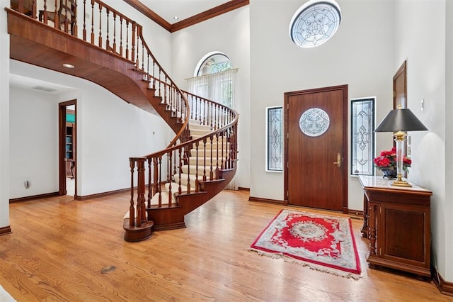 4200 Oakdale Farm Cir, Edmond, OK 73013 - entrance foyer featuring stairs, a high ceiling, visible vents, and wood finished floors