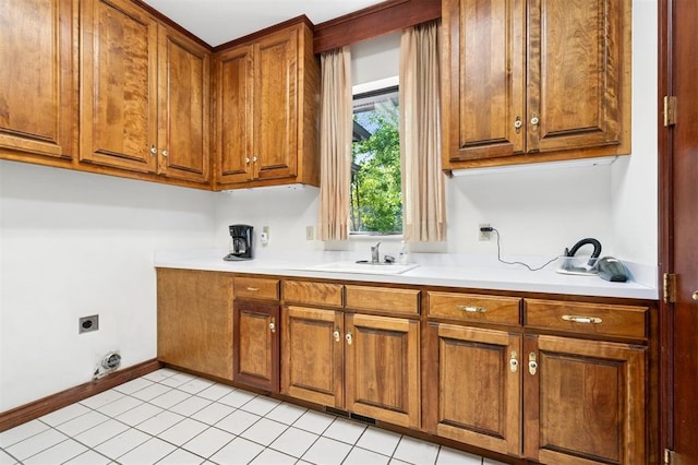4200 Oakdale Farm Cir, Edmond, OK 73013 - washroom featuring baseboards, light tile patterned floors, a sink, cabinet space, and electric dryer hookup