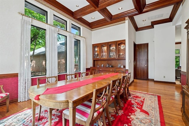 4200 Oakdale Farm Cir, Edmond, OK 73013 - dining room featuring crown molding, a high ceiling, beamed ceiling, and wood finished floors