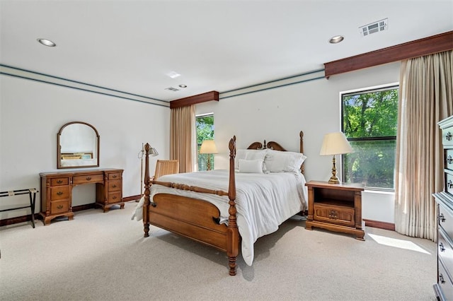 4200 Oakdale Farm Cir, Edmond, OK 73013 - bedroom with baseboards, multiple windows, visible vents, and light colored carpet