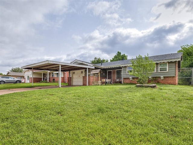 view of front facade with concrete driveway, a front lawn, and brick siding