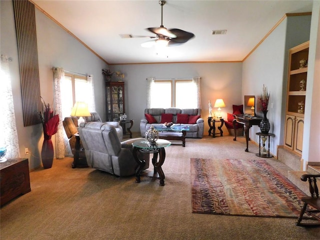 carpeted living area with plenty of natural light, ornamental molding, and a ceiling fan