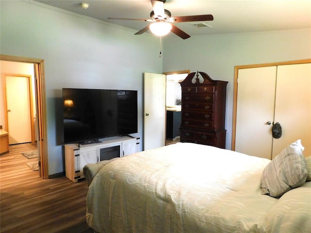 bedroom with visible vents, wood finished floors, a ceiling fan, and crown molding