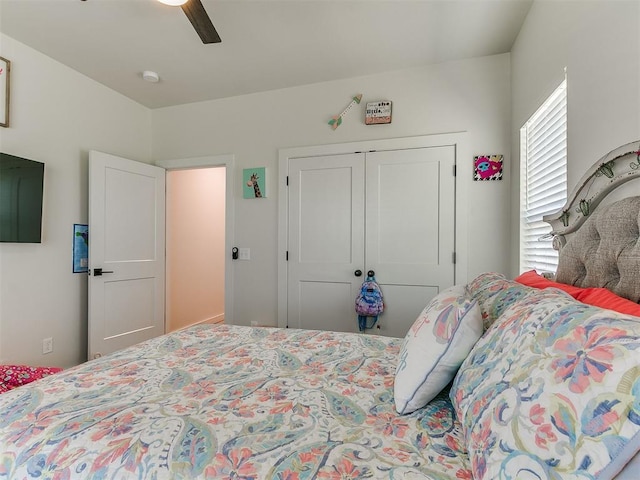 bedroom featuring a closet and a ceiling fan