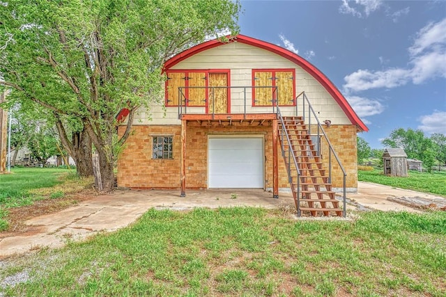 22676 N Rte 66, Clinton, OK 73601 - view of front of house featuring stairs, an attached garage, and a front lawn