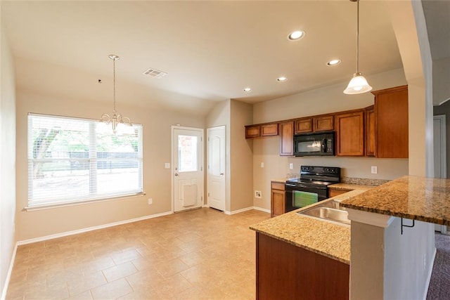 kitchen with baseboards, brown cabinetry, black appliances, and visible vents