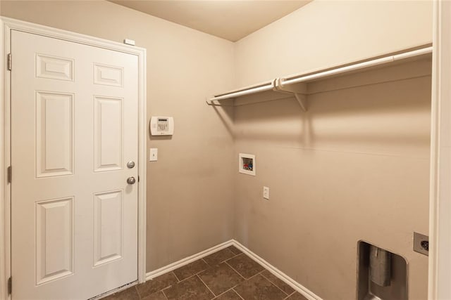 laundry room with laundry area, baseboards, hookup for a washing machine, dark tile patterned flooring, and hookup for an electric dryer