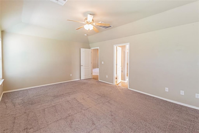 carpeted empty room with visible vents, a ceiling fan, and baseboards