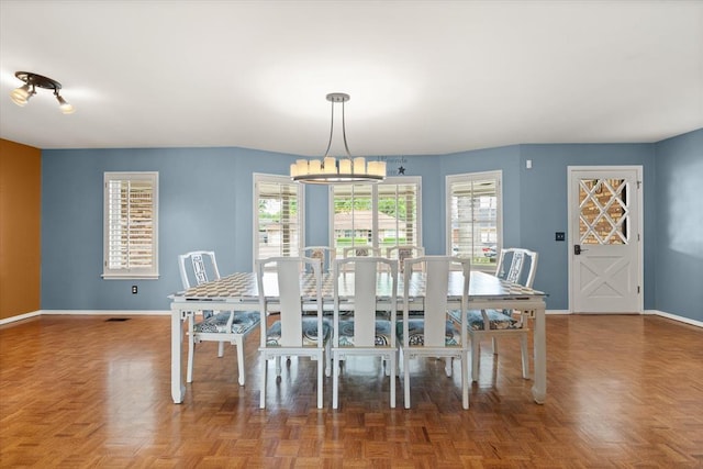 dining area featuring baseboards