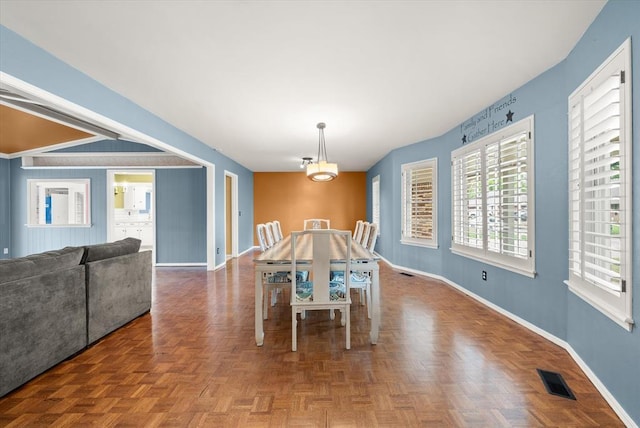 dining area featuring baseboards and visible vents