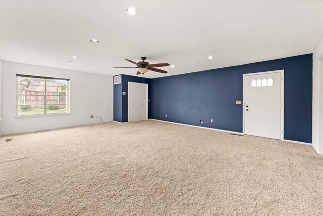 carpeted spare room featuring recessed lighting, ceiling fan, and baseboards