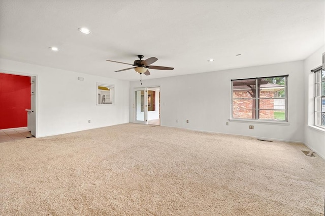 carpeted empty room with recessed lighting, ceiling fan, and visible vents