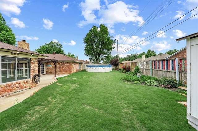view of yard with a fenced in pool and a fenced backyard