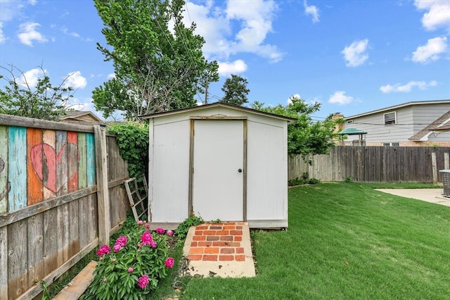 view of shed featuring a fenced backyard