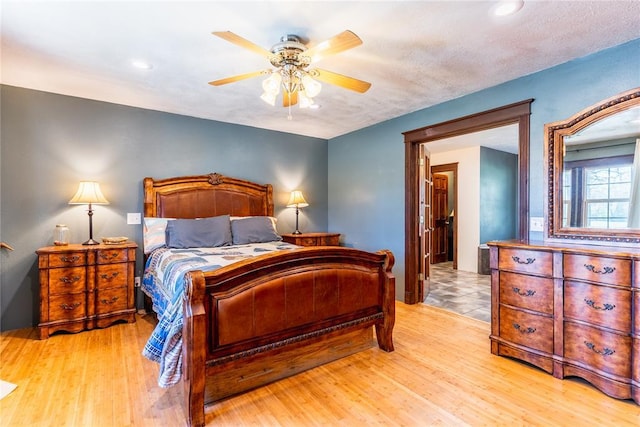 bedroom featuring ceiling fan, recessed lighting, and light wood-style flooring