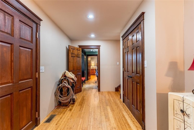 interior space featuring recessed lighting, visible vents, and light wood-style flooring