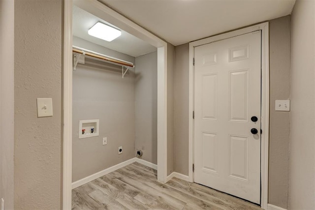 washroom with hookup for an electric dryer, laundry area, light wood-type flooring, baseboards, and hookup for a washing machine