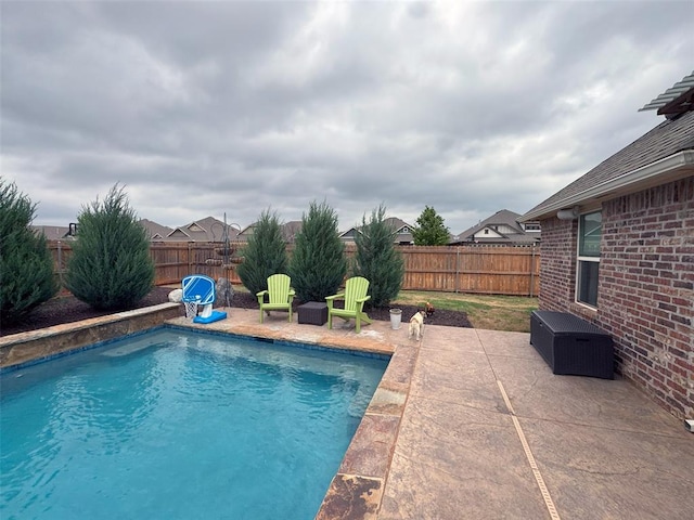 view of pool featuring a fenced in pool, central AC, a fenced backyard, and a patio area
