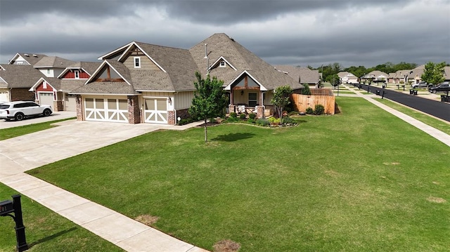 craftsman-style house featuring brick siding, a garage, a residential view, a front lawn, and concrete driveway