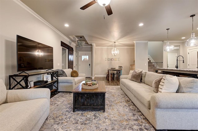 2201 Creek Side Cir, Moore, OK 73160 - living room with ornamental molding, ceiling fan, recessed lighting, wood finished floors, and baseboards