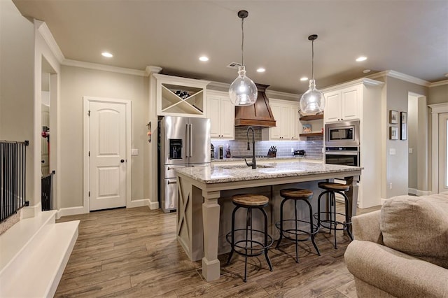 2201 Creek Side Cir, Moore, OK 73160 - kitchen with appliances with stainless steel finishes, open shelves, ornamental molding, white cabinets, and backsplash