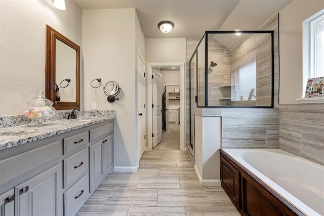 2201 Creek Side Cir, Moore, OK 73160 - bathroom featuring a bath, a shower stall, and vanity