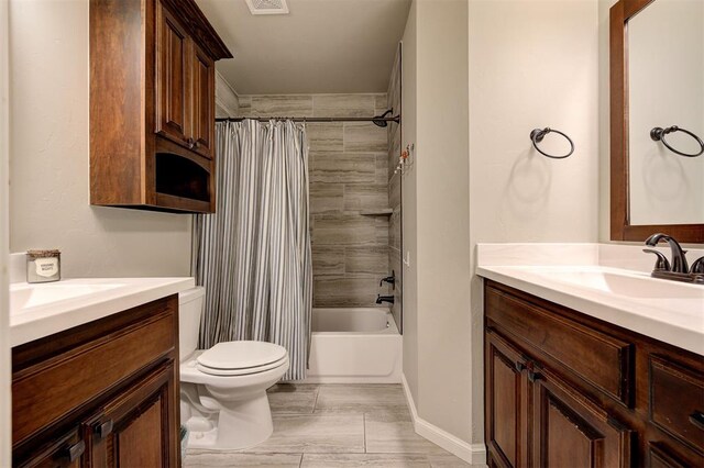2201 Creek Side Cir, Moore, OK 73160 - full bath with vanity, toilet, shower / bath combo, and baseboards