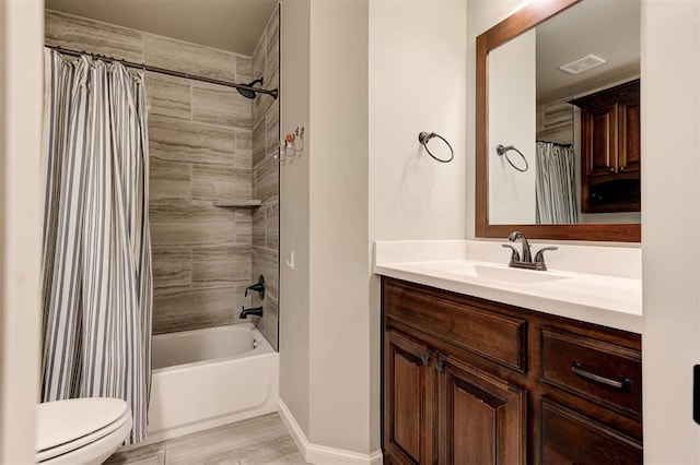 2201 Creek Side Cir, Moore, OK 73160 - bathroom featuring toilet, baseboards, vanity, and shower / bath combo