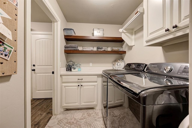 2201 Creek Side Cir, Moore, OK 73160 - washroom featuring washer and clothes dryer, cabinet space, and light wood-style flooring