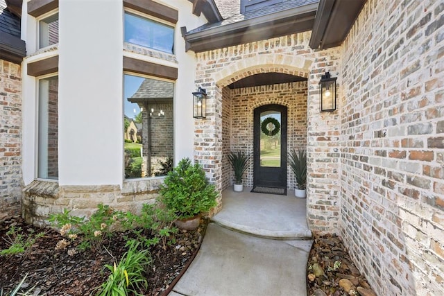 property entrance with brick siding