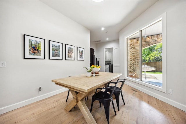 dining room with recessed lighting, baseboards, visible vents, and light wood-type flooring
