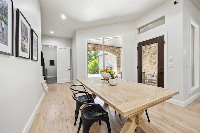 dining area with recessed lighting, baseboards, and light wood-type flooring